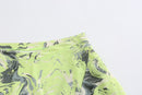 NEON GREEN ASYMMETRIC WRAP. SKIRT WITH. CUT-OUTS