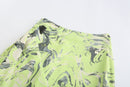 NEON GREEN ASYMMETRIC WRAP. SKIRT WITH. CUT-OUTS