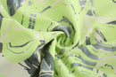 NEON GREEN ASYMMETRIC WRAP. SKIRT WITH. CUT-OUTS