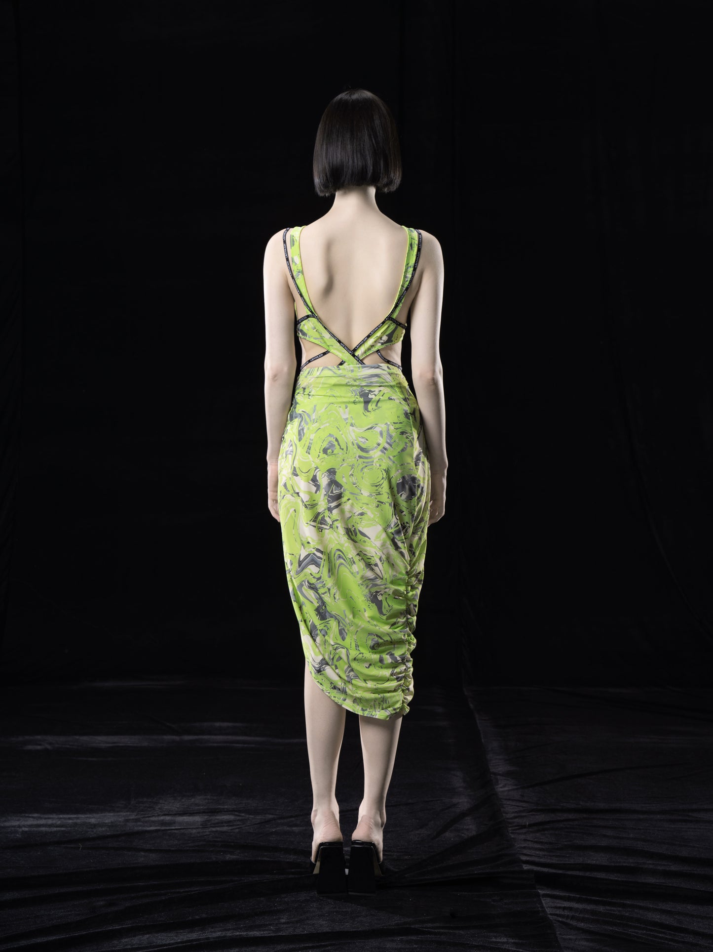 NEON GREEN ASYMMETRIC WRAP. SKIRT WITH. CUT-OUTS